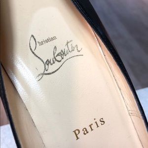 Christian Louboutin platform peep toe pumps.